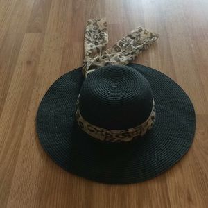 Black straw hat with leopard scarf accent